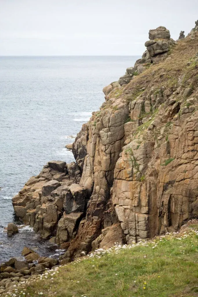 The surrounding cliffs at Porthgwarra Beach, Cornwall