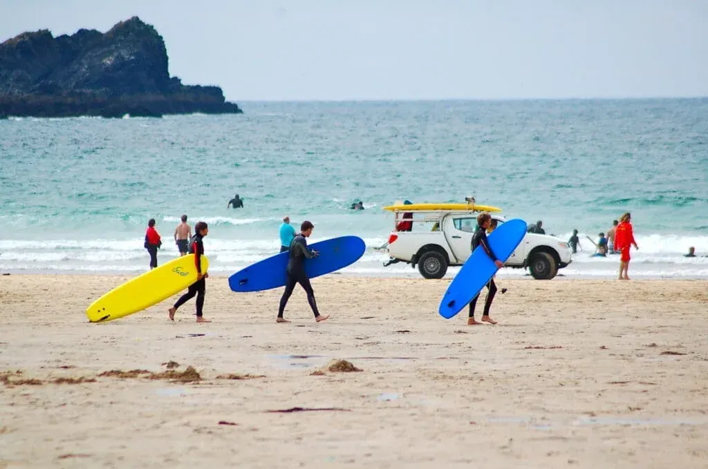 Surfers get ready to hit the waves at Fistral Beach, Newquay