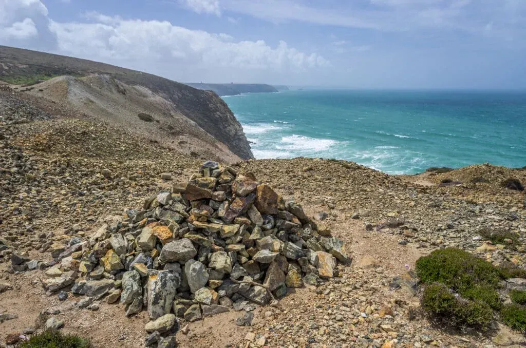 Historic tin mine spoil on the cliff, overlooking Chapel Porth Beach, St Agnes, Cornwall