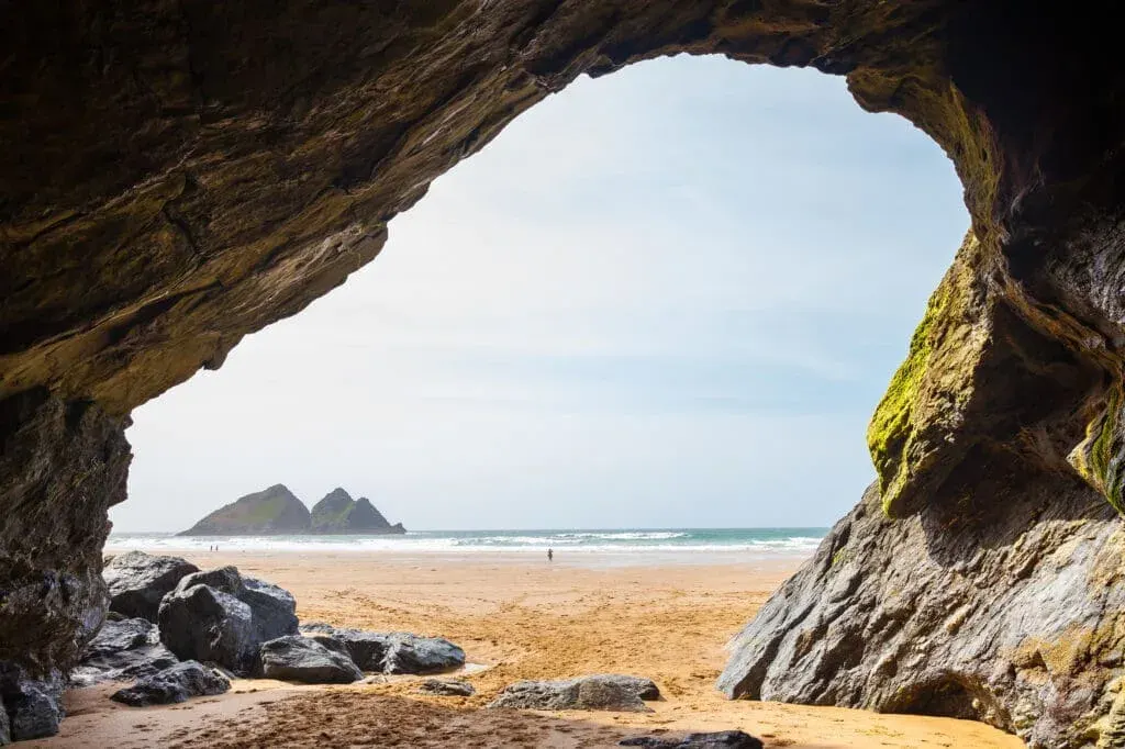Holywell Bay Beach, Cornwall, with. clear skies and the iconic Gull Rocks in the background