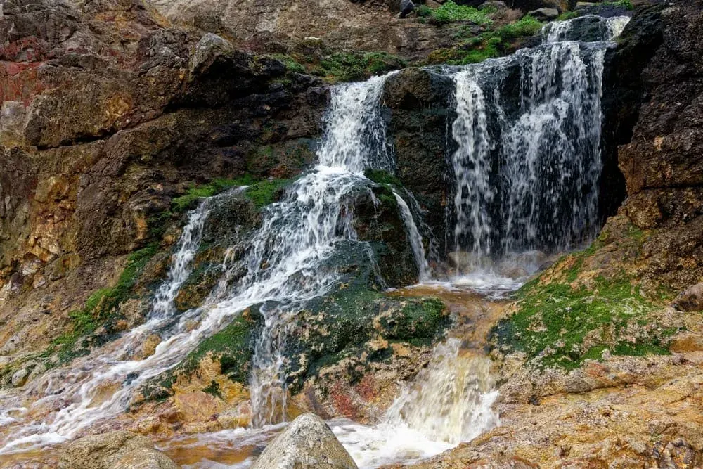 The iconic waterfall on Nanjizal Beach (Mill Bay), Cornwall