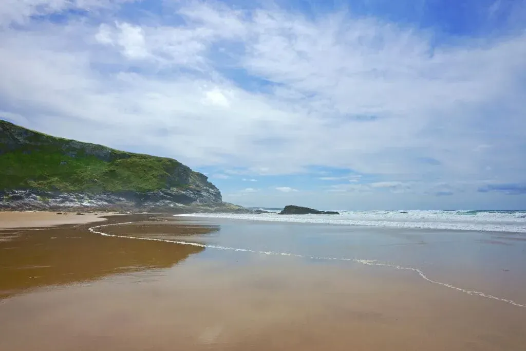Low tide on a brisk spring afternoon at Mawgan Porth Beach, Newquay, North Cornwall