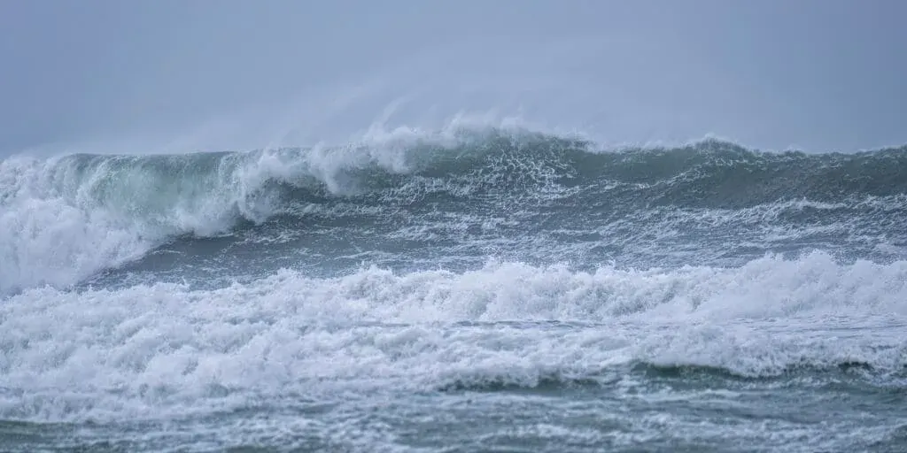 A curling wave at Porthleven Beach