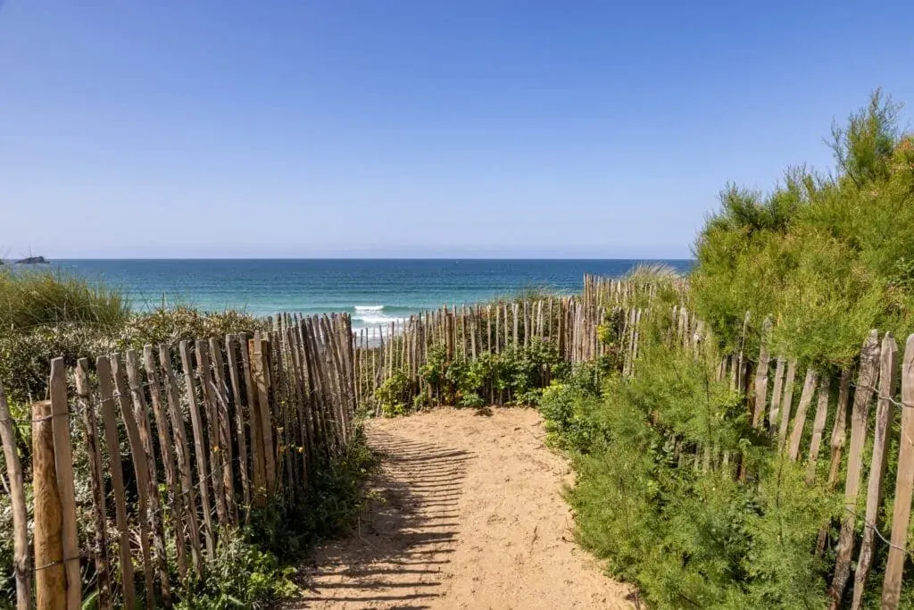 A wooden fence leading to Fistral Beach, Cornwall