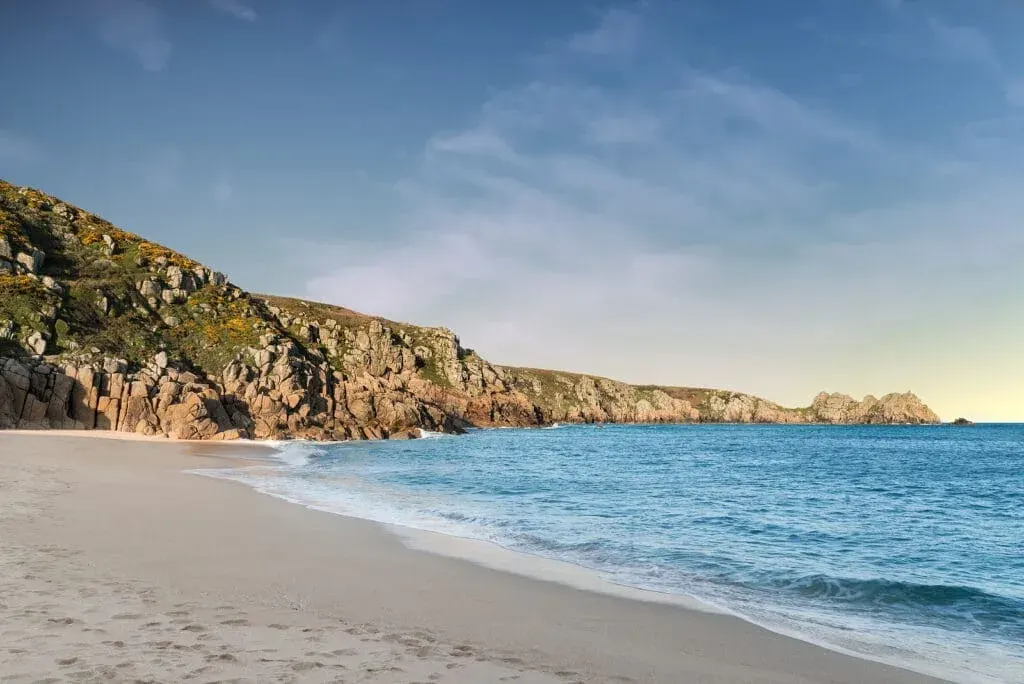 Beautiful sunset landscape at Porthcurno Beach, Cornwall