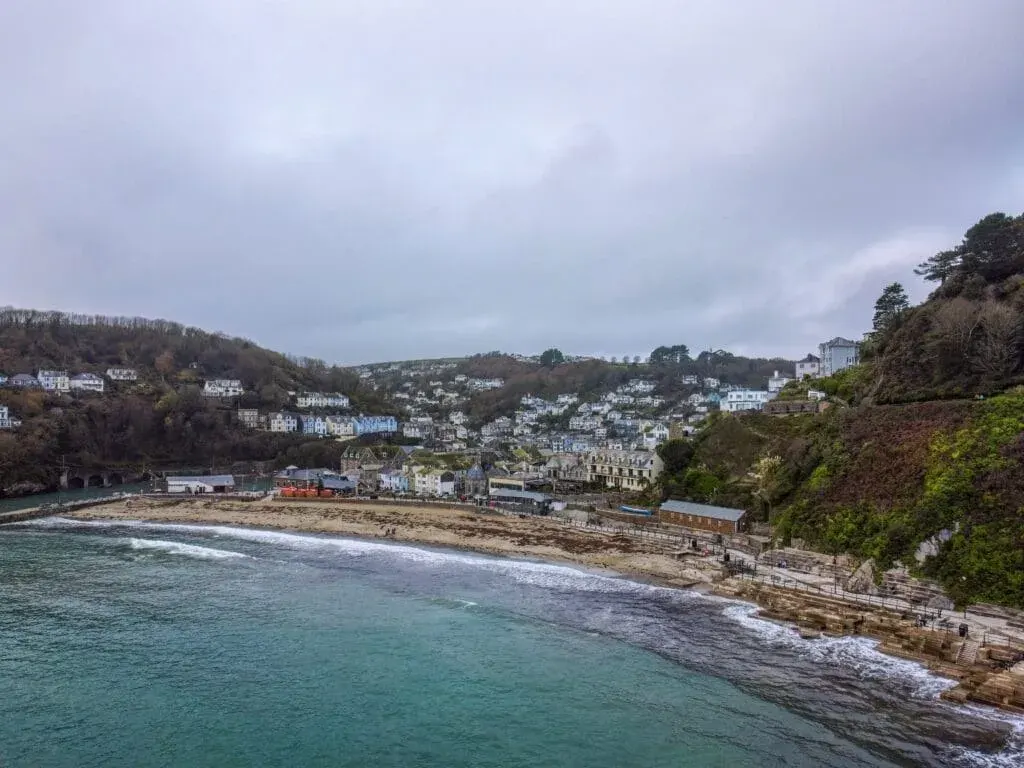 An aerial photo of East Looe Beach and Looe village from the air