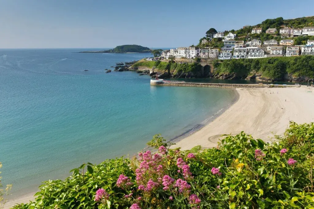 A view across East Looe Beach on a calm summer’s day