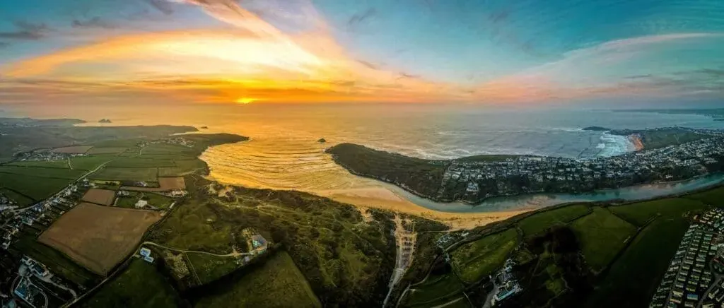 Sunset over the caravan park at Crantock Beach in Cornwall, UK.
