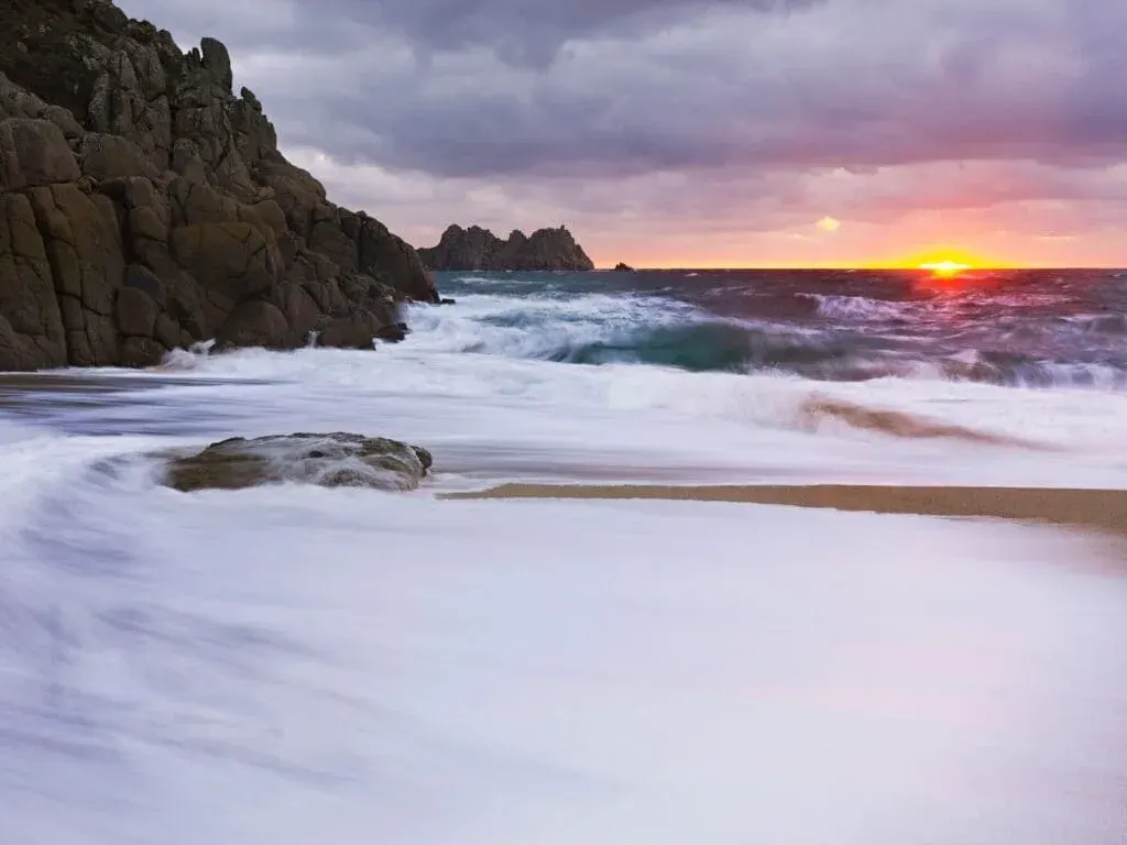 Early morning at Porthcurno Beach, Cornwall, overlooking Logan Rock