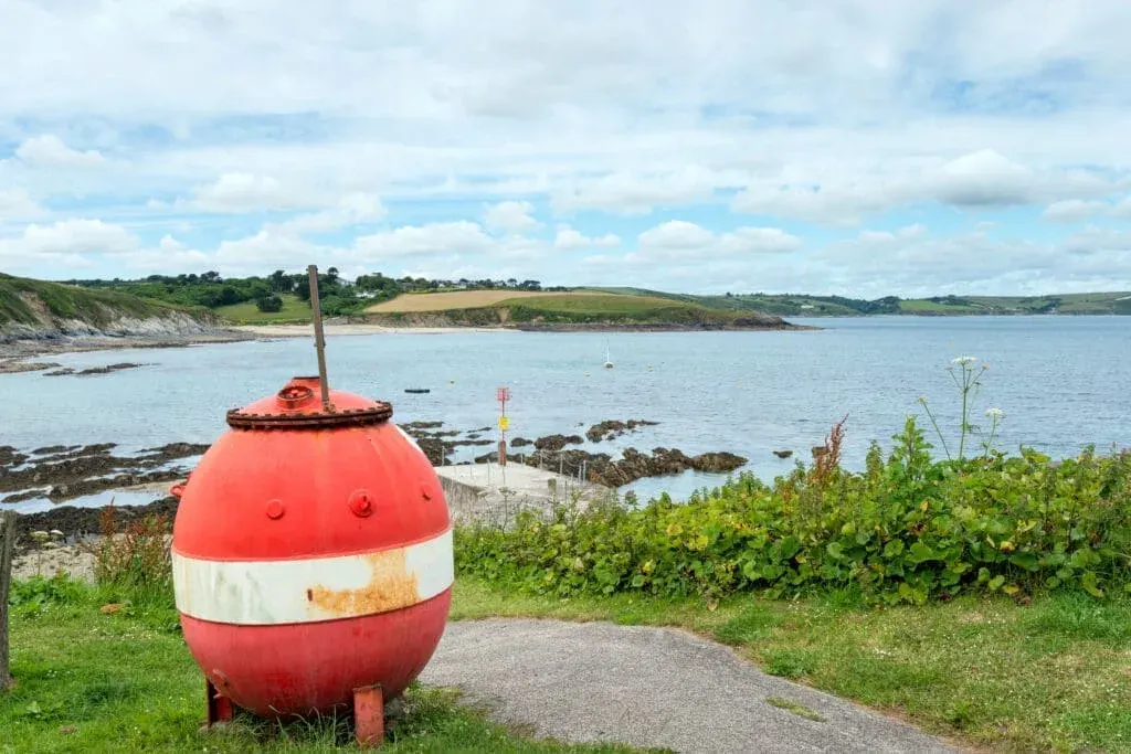 An old buoy above the harbour, overlooking Portscatho beach