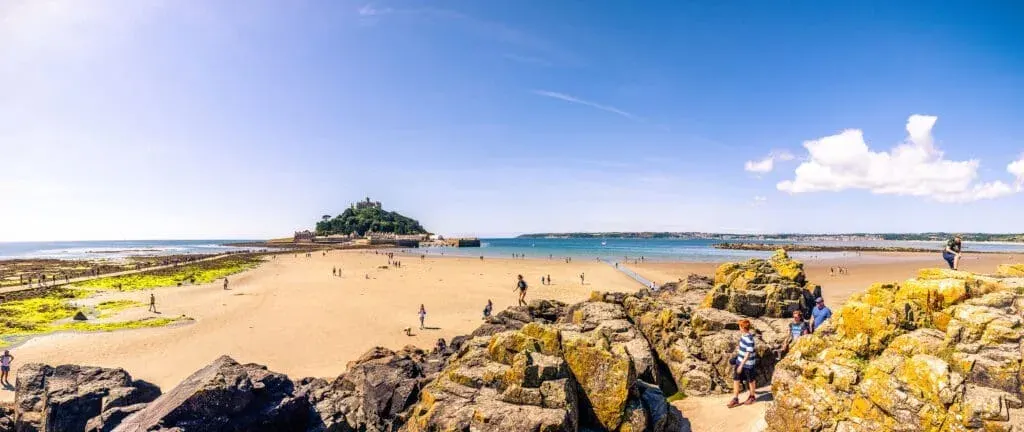 Marazion Beach at low tide on a summer’s day, with the imposing St Michael’s Mount in the background
